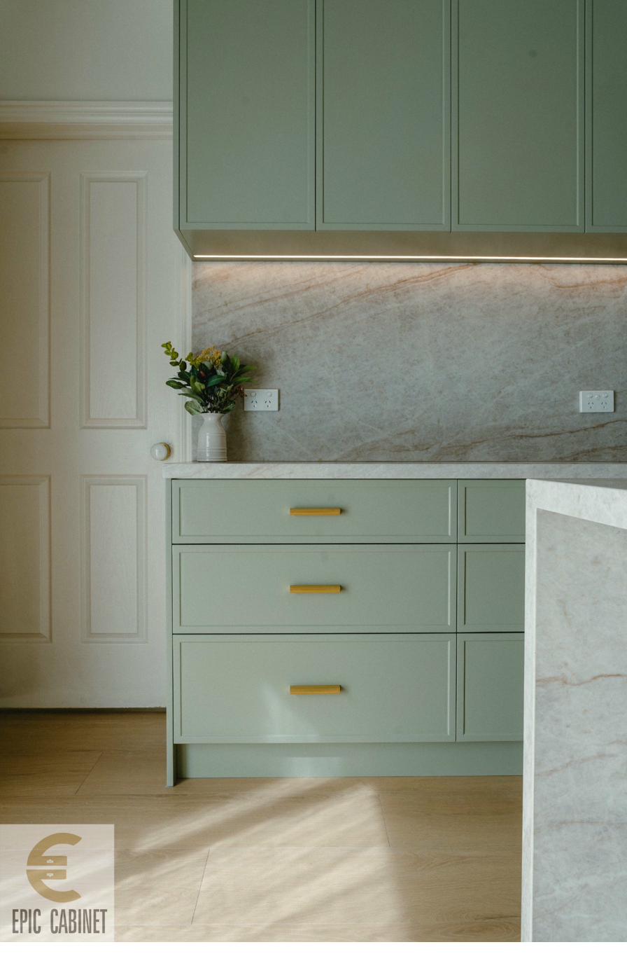 McKinnon kitchen — flat-panel sage cabinetry